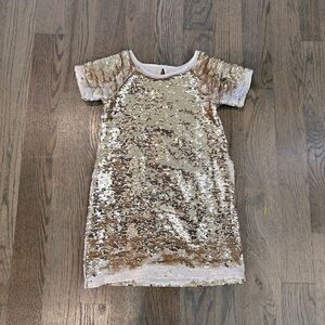 Peek— gold flip sequin holiday party dress.